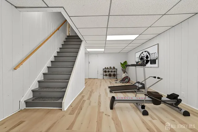 a view of a room with wooden floor