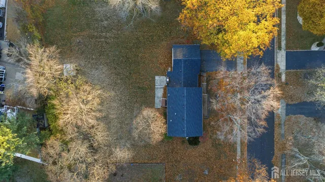 an aerial view of lake and residential houses with outdoor space