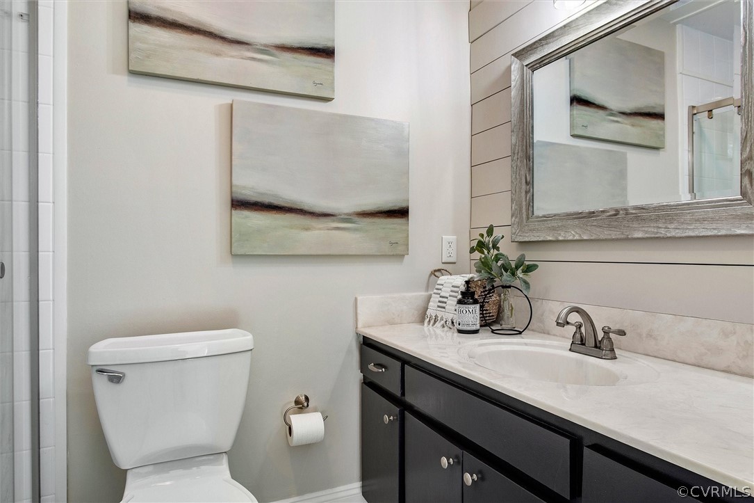 1970 Albion Road Midlothian, VA 23113 - Photo 25 of 50 a bathroom with a granite countertop sink mirror and toilet