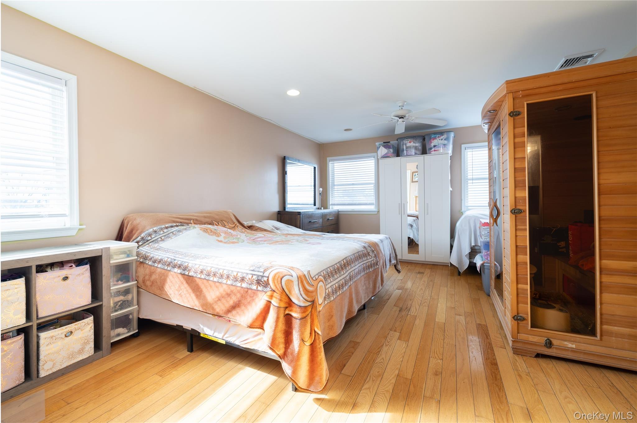 458 East Pine Street Long Beach, NY 11561 - Photo 17 of 26 a spacious bedroom with a bed and a window