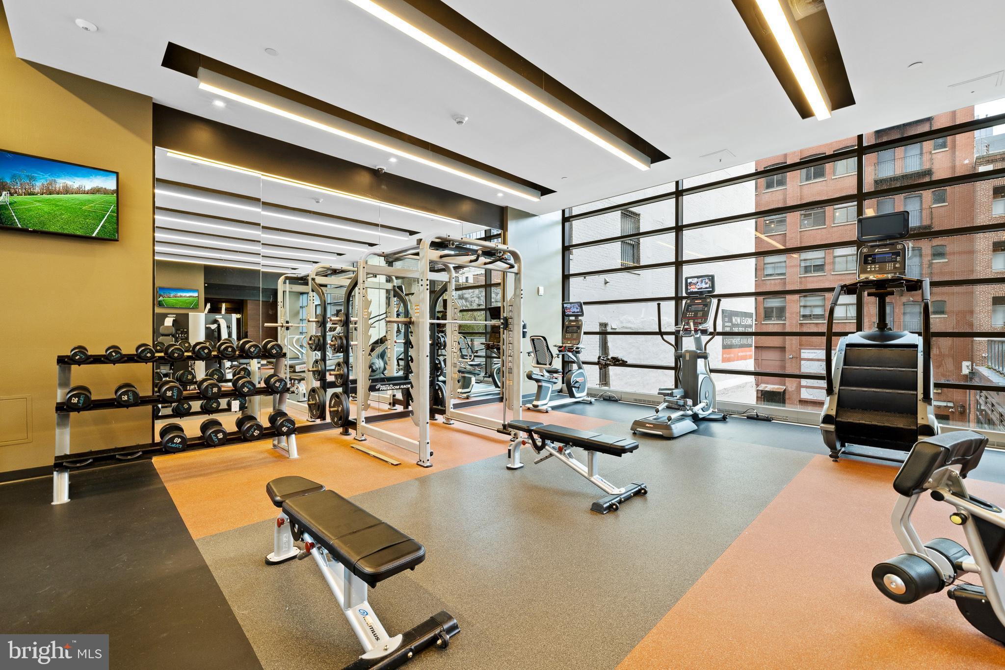 1213 Walnut Street, Unit 2502 Philadelphia, PA 19107 - Photo 20 of 36 a room with gym equipment and view of living room
