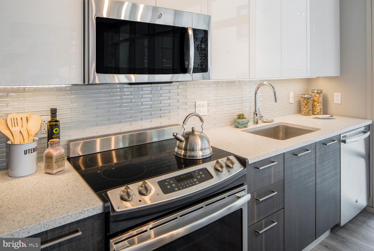 1213 Walnut Street, Unit 2502 Philadelphia, PA 19107 - Photo 3 of 36 a kitchen with a stove and a sink