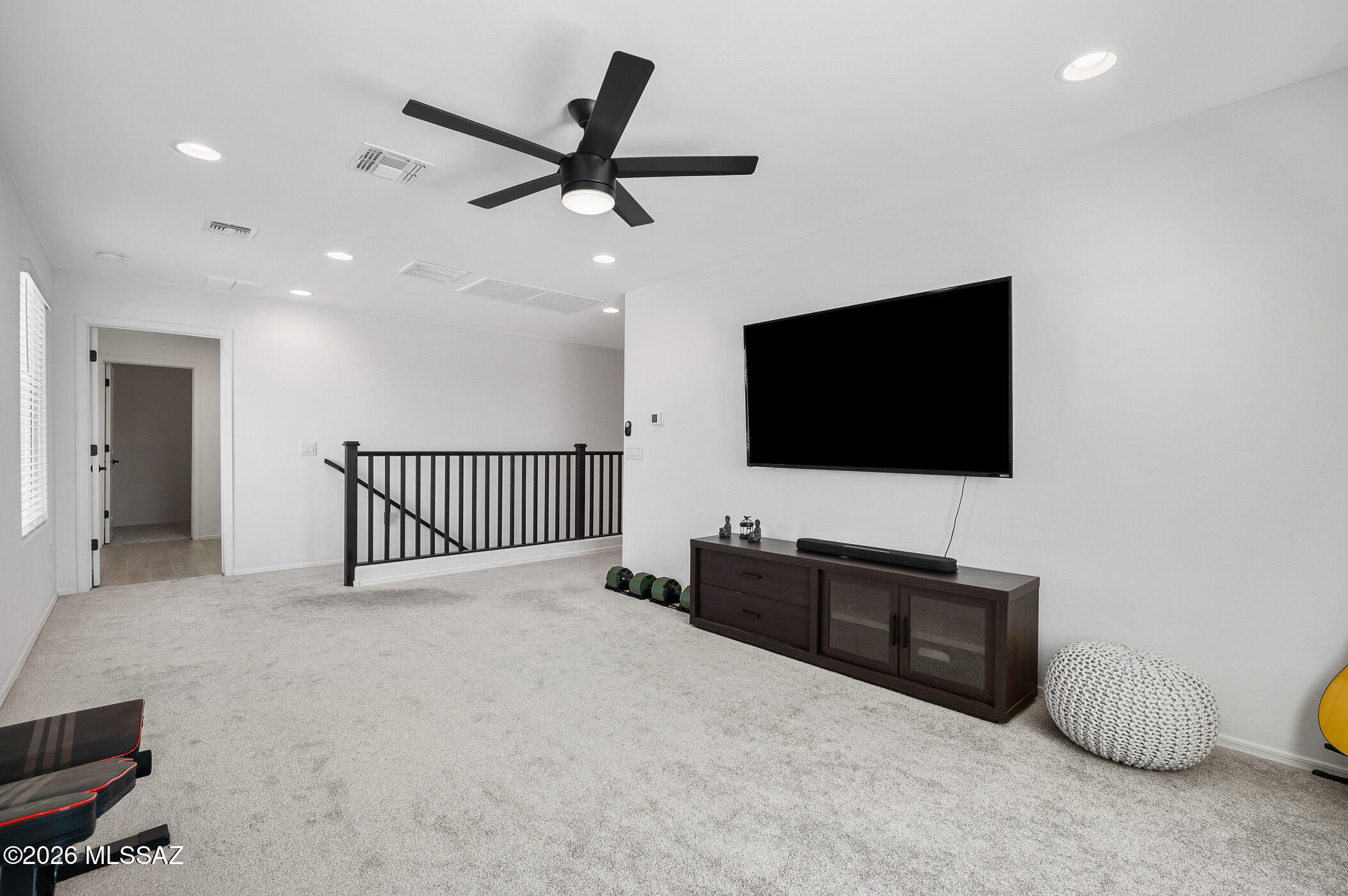 12092 East Ryscott Circle Vail, AZ 85641 - Photo 27 of 49 a living room with furniture and a flat screen tv