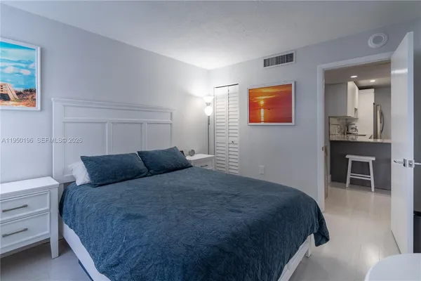 a bedroom with a bed and a table in it