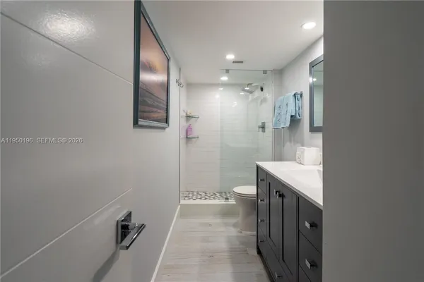 a bathroom with a sink and mirror