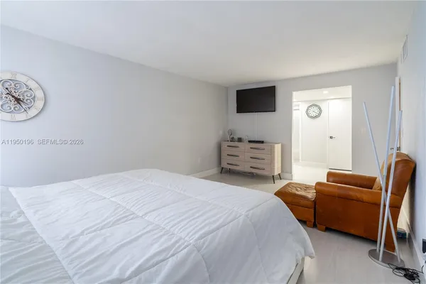a bedroom with a bed and furniture