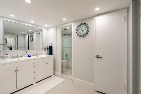 a view of bathroom with mirror and sink