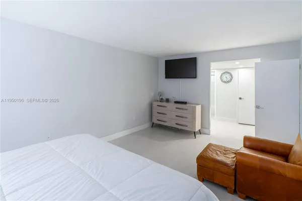 a bedroom with furniture and a bed