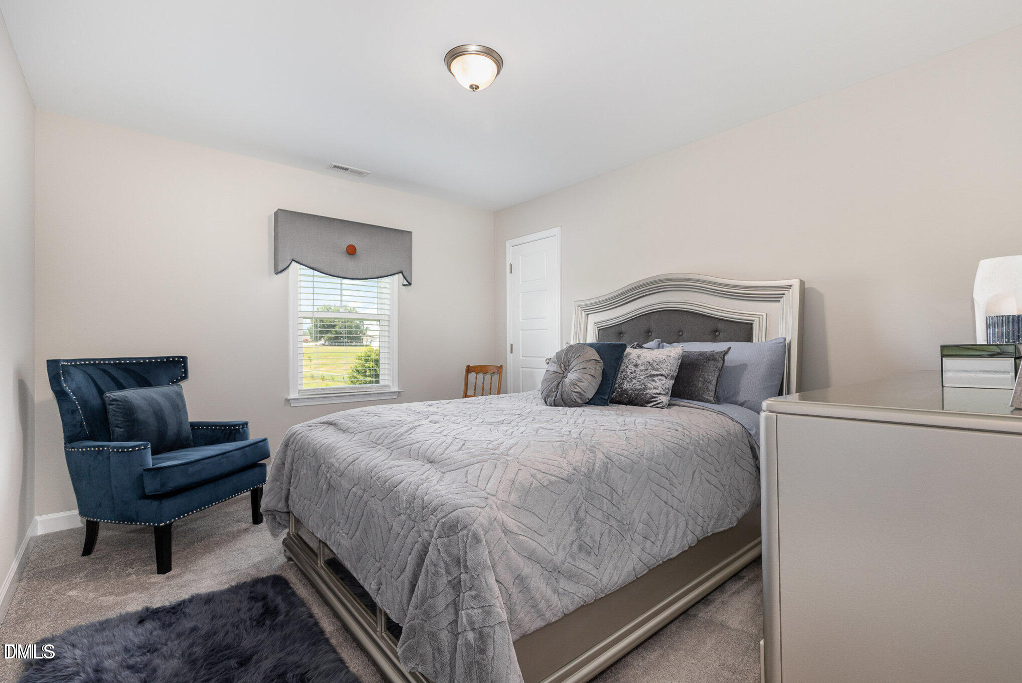 8662 Buckhorn Plantation Road Sims, NC 27880 - Photo 35 of 37 a bedroom with a bed and a couch