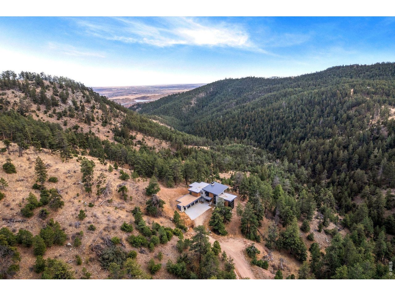 16132 Steller Ridge Road Loveland, CO 80538 - Photo 49 of 50 Located just behind Horsetooth Reservoir/Mountain with views of glistening Fort Collins city lights at night