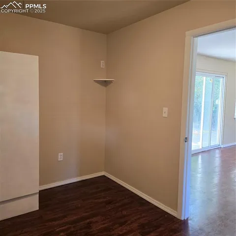a view of a small space with wooden floor