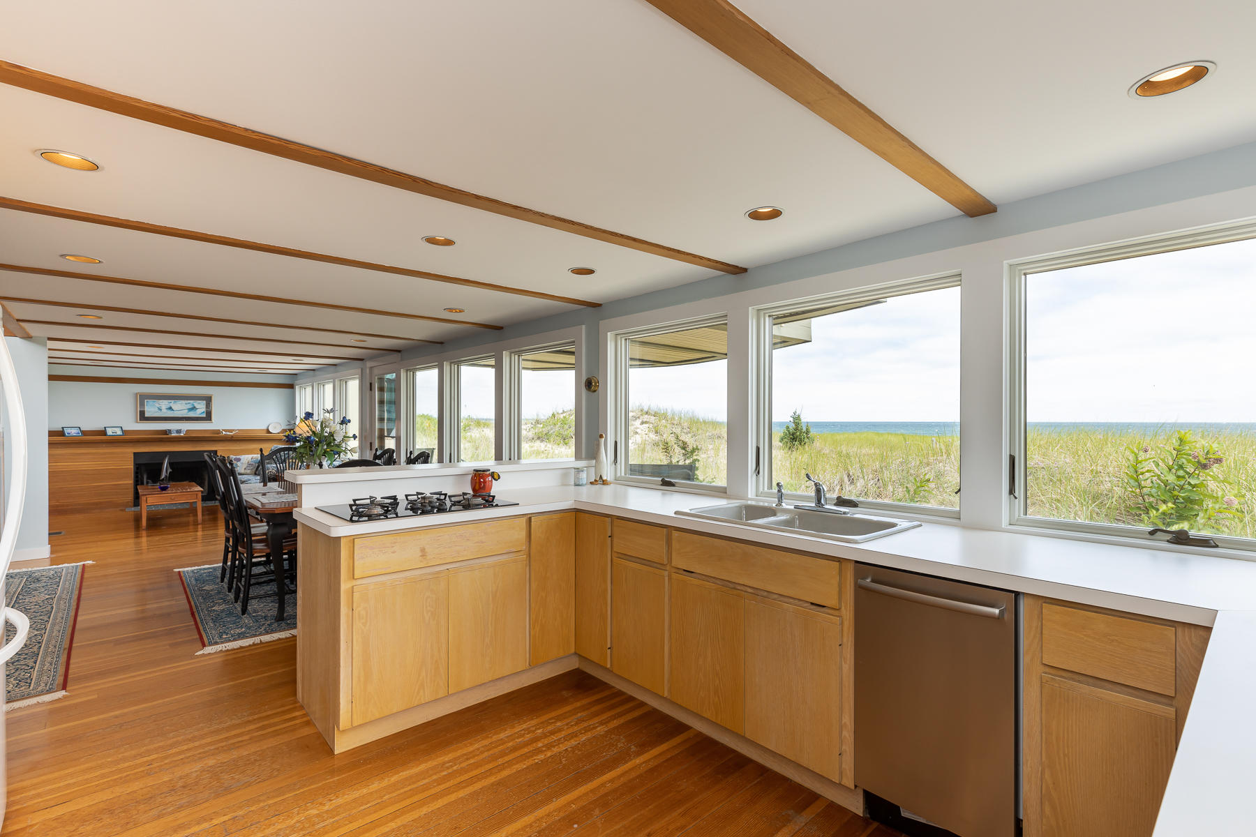315 Phillips Road Sandwich, MA 02563 - Photo 3 of 30 a kitchen with a sink window and wooden floor