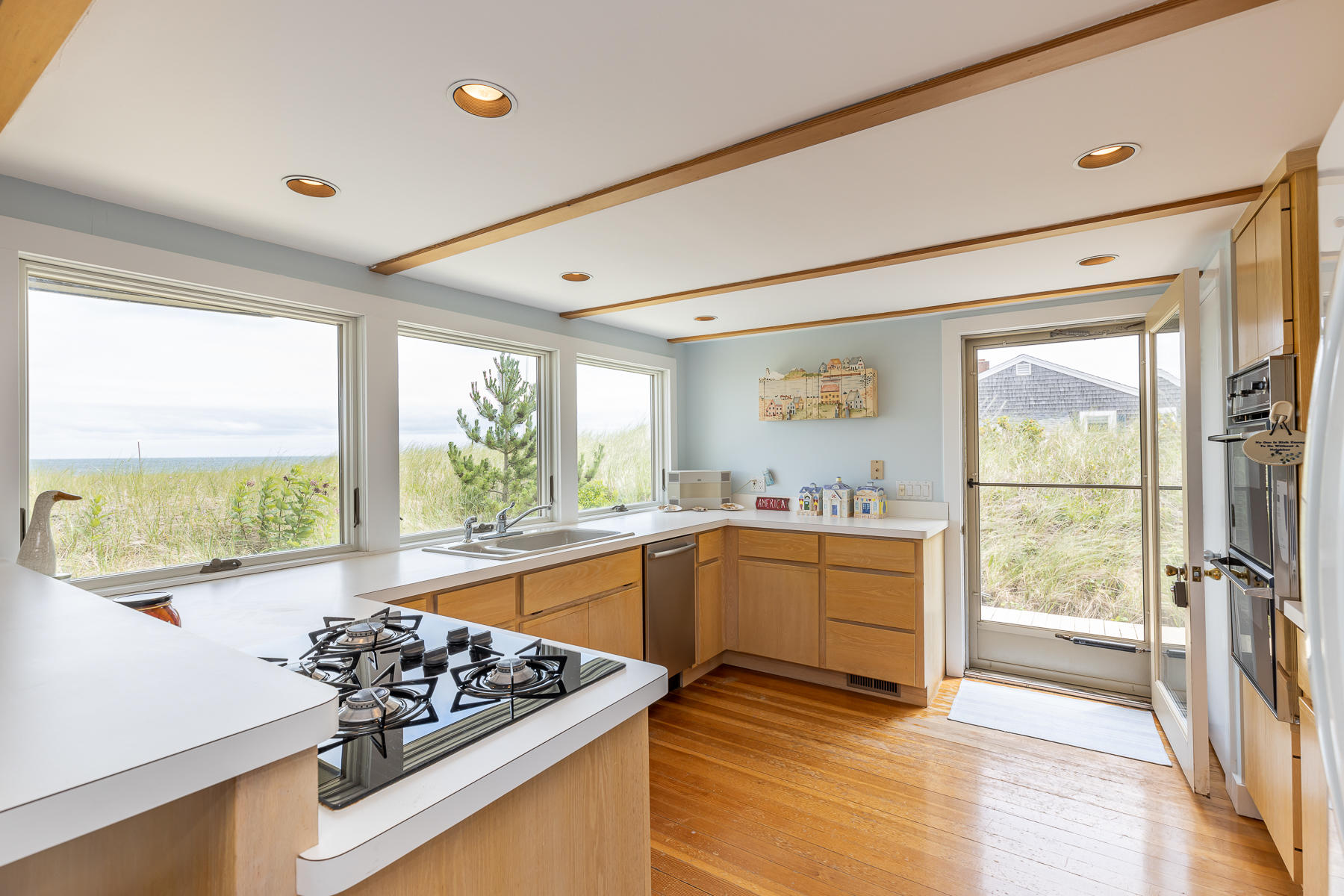 315 Phillips Road Sandwich, MA 02563 - Photo 4 of 30 a kitchen that has a lot of cabinets in it and wooden floor