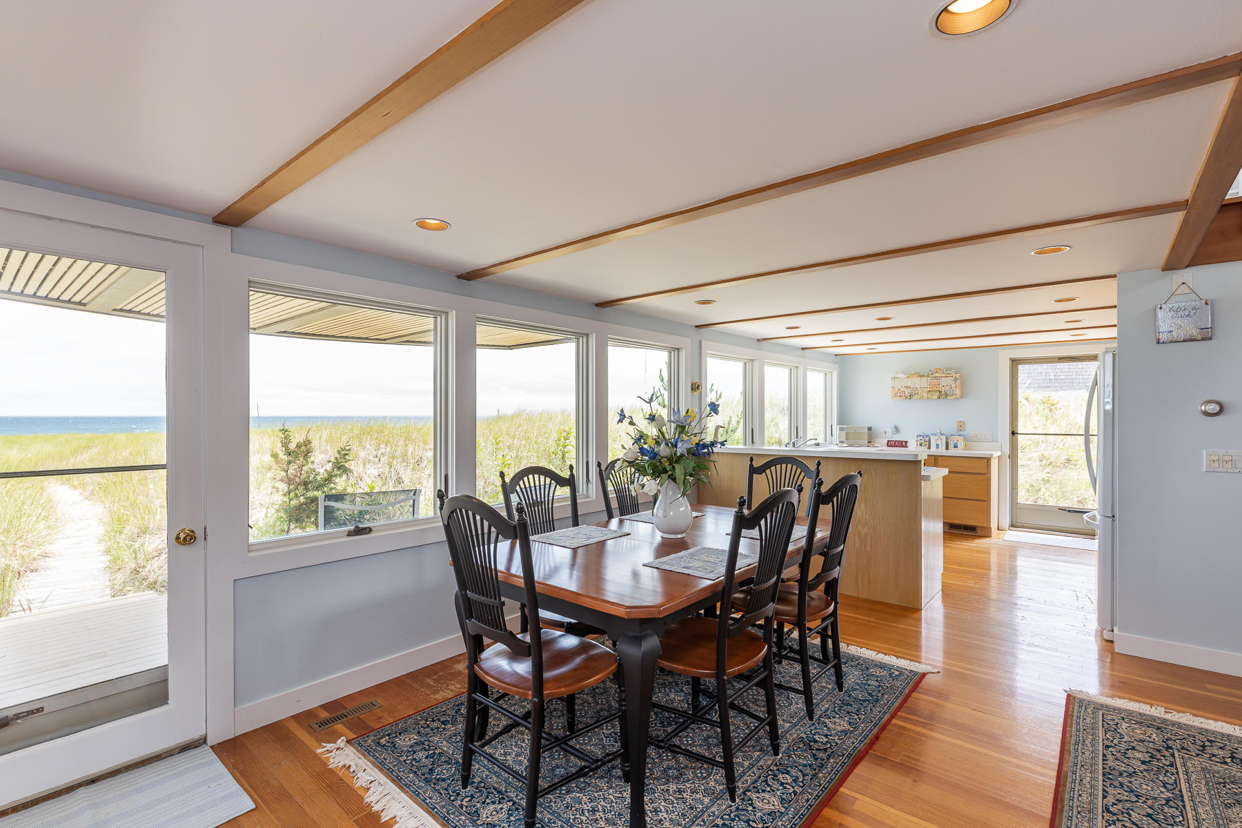 315 Phillips Road Sandwich, MA 02563 - Photo 6 of 30 a view of a dining room with furniture window and wooden floor