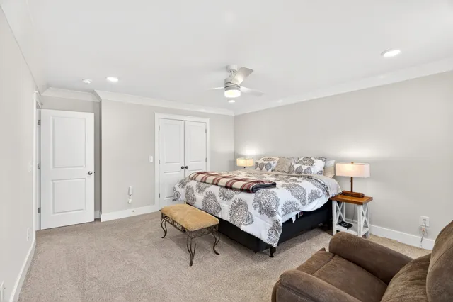 a spacious bedroom with a bed and a couch