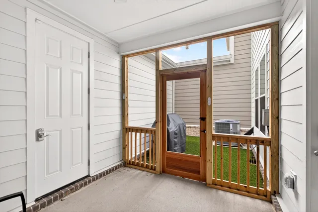 a view of a room with balcony and furniture