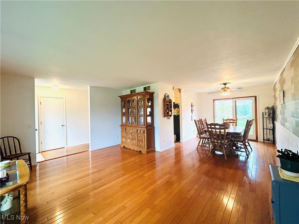 7028 Streeter Road Windham, OH 44288 - Photo 12 of 33 Dining room featuring wood-type flooring and ceiling fan