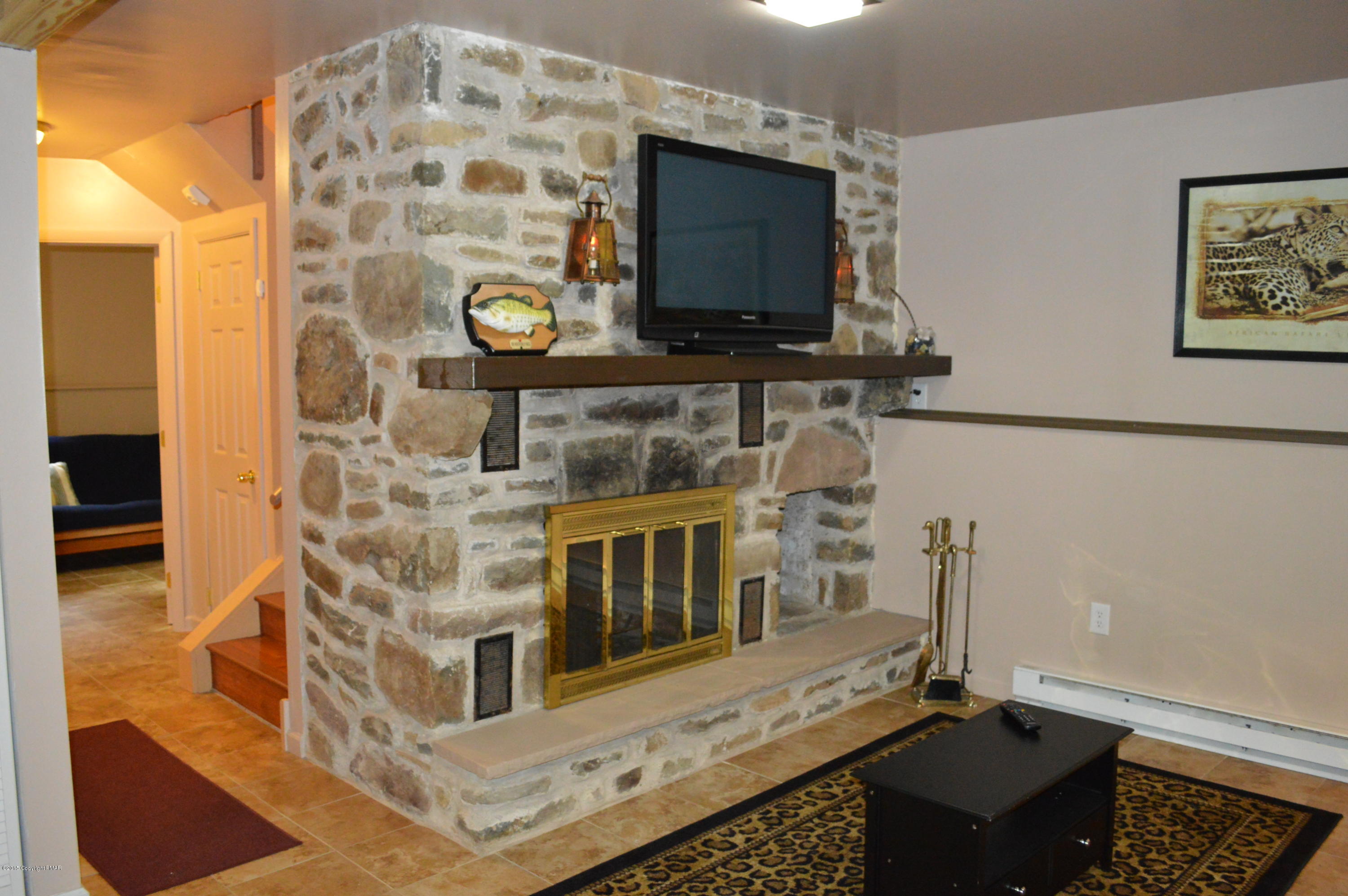 180 Brier Crest Road Blakeslee, PA 18610 - Photo 21 of 32 Family Room Fireplace