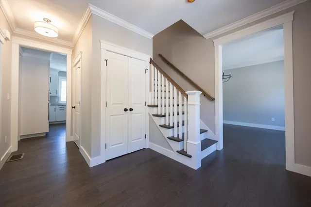 wooden floor with white walls and windows