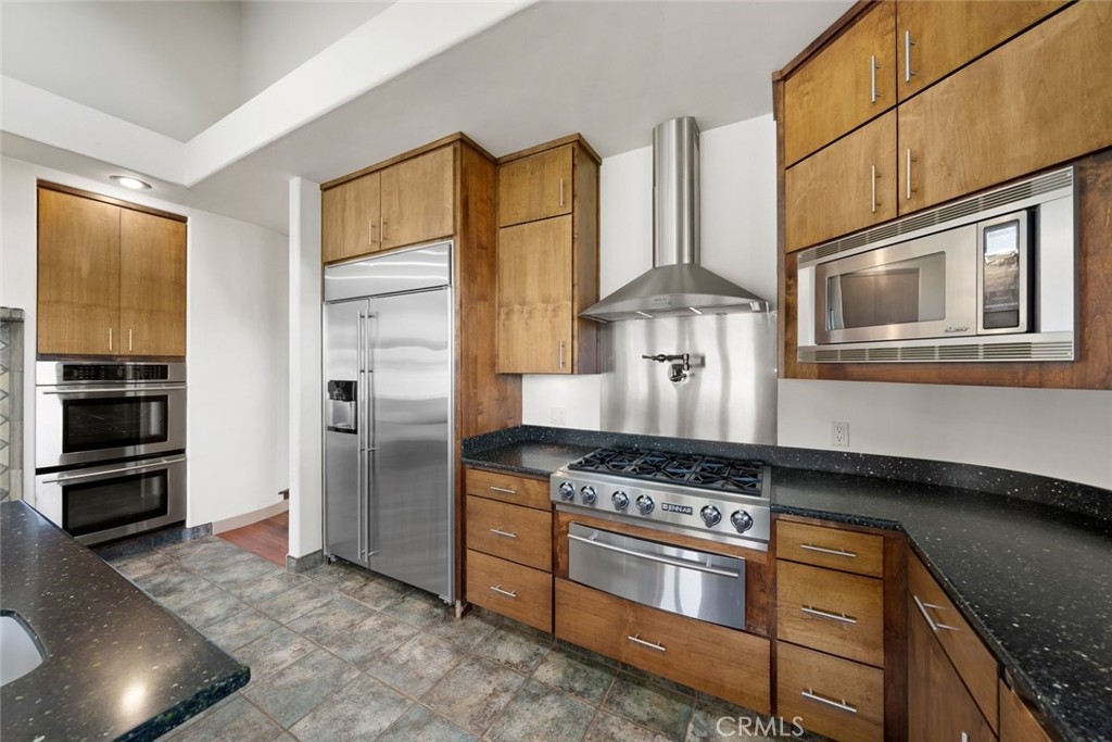 5840 Rocky Canyon Road Atascadero, CA 93422 - Photo 13 of 74 a kitchen with stainless steel appliances granite countertop a stove and a refrigerator