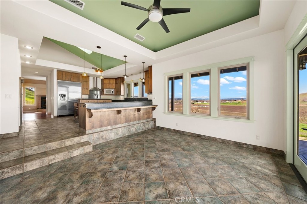 5840 Rocky Canyon Road Atascadero, CA 93422 - Photo 19 of 74 a large kitchen with stainless steel appliances granite countertop a stove and cabinets