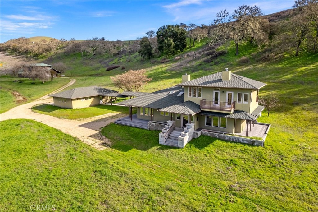 5840 Rocky Canyon Road Atascadero, CA 93422 - Photo 2 of 74 an aerial view of a house with a garden and lake view