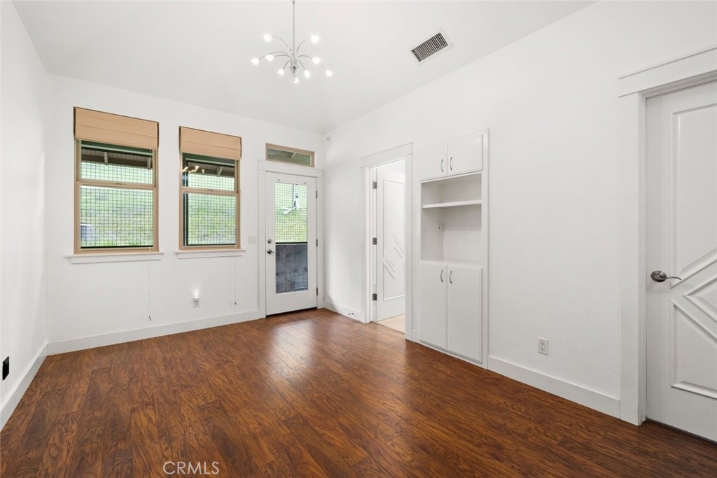 5840 Rocky Canyon Road Atascadero, CA 93422 - Photo 41 of 74 an empty room with wooden floor and windows