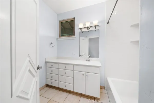 a view of a big yard with swimming pool and green space