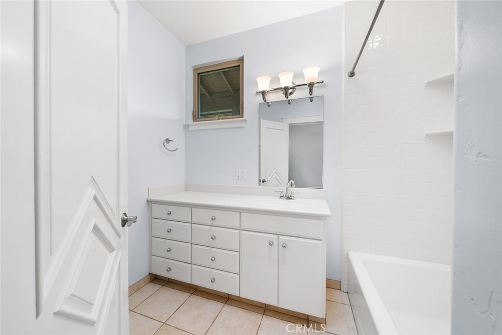 5840 Rocky Canyon Road Atascadero, CA 93422 - Photo 42 of 74 a bathroom with a sink a vanity and mirror