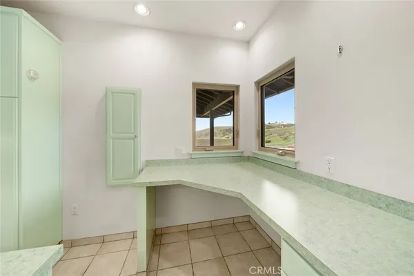 a view of a kitchen with electric appliances