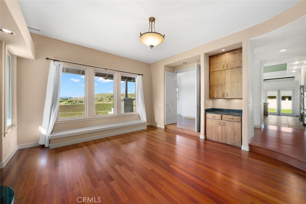 5840 Rocky Canyon Road Atascadero, CA 93422 - Photo 6 of 74 a view of an empty room with wooden floor and a window