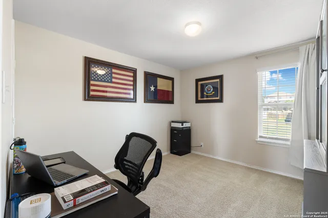 a living room with furniture and a window