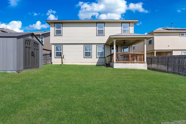 a front view of a house with a yard and porch