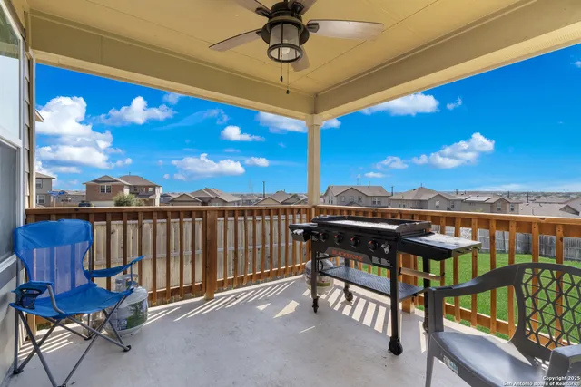 a view of a balcony with furniture