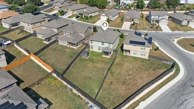 an aerial view of residential house with outdoor space