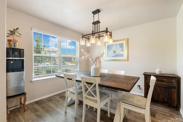 a view of a dining room with furniture window and outside view