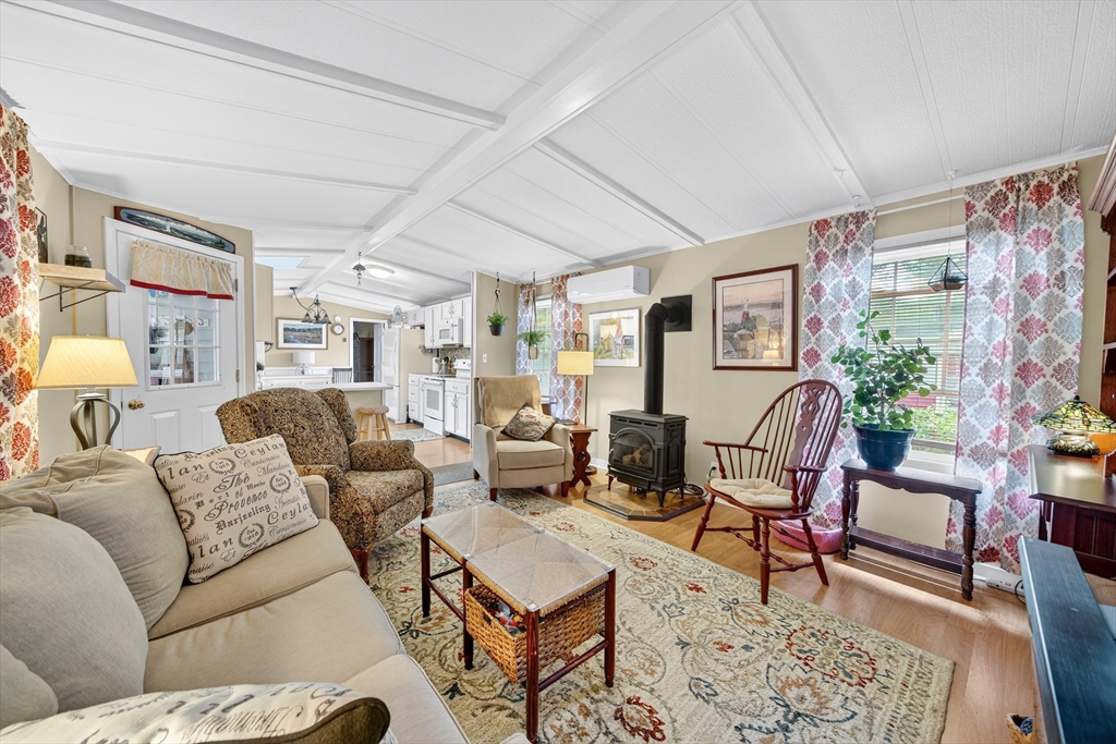 32 Windswept Road Wareham, MA 02576 - Photo 12 of 39 a living room with furniture and a potted plant