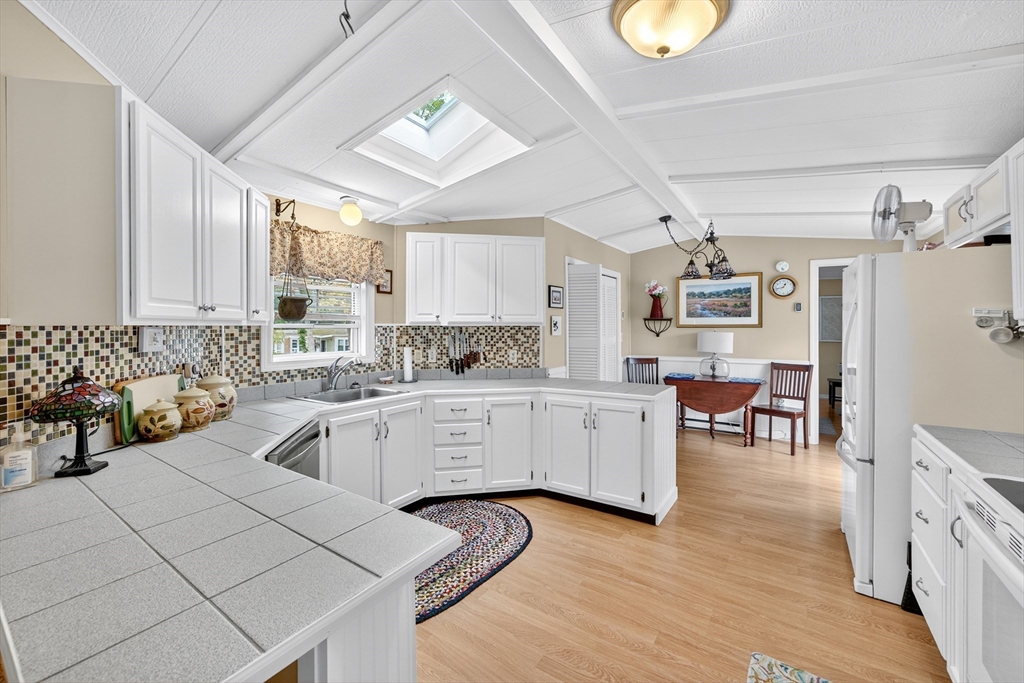 32 Windswept Road Wareham, MA 02576 - Photo 18 of 39 a kitchen with cabinets a sink and appliances