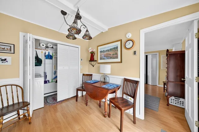 a view of a livingroom with furniture and a dining table