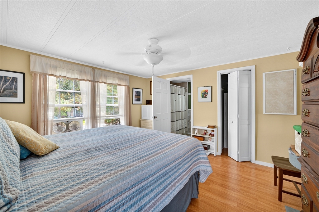 32 Windswept Road Wareham, MA 02576 - Photo 25 of 39 a bedroom with a bed and wooden floor