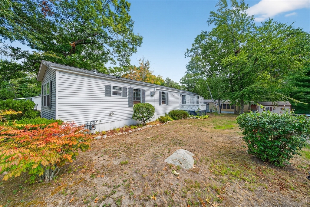 32 Windswept Road Wareham, MA 02576 - Photo 6 of 39 a backyard of a house with plants and trees