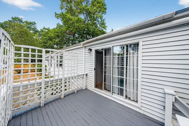 a view of a porch with wooden floor