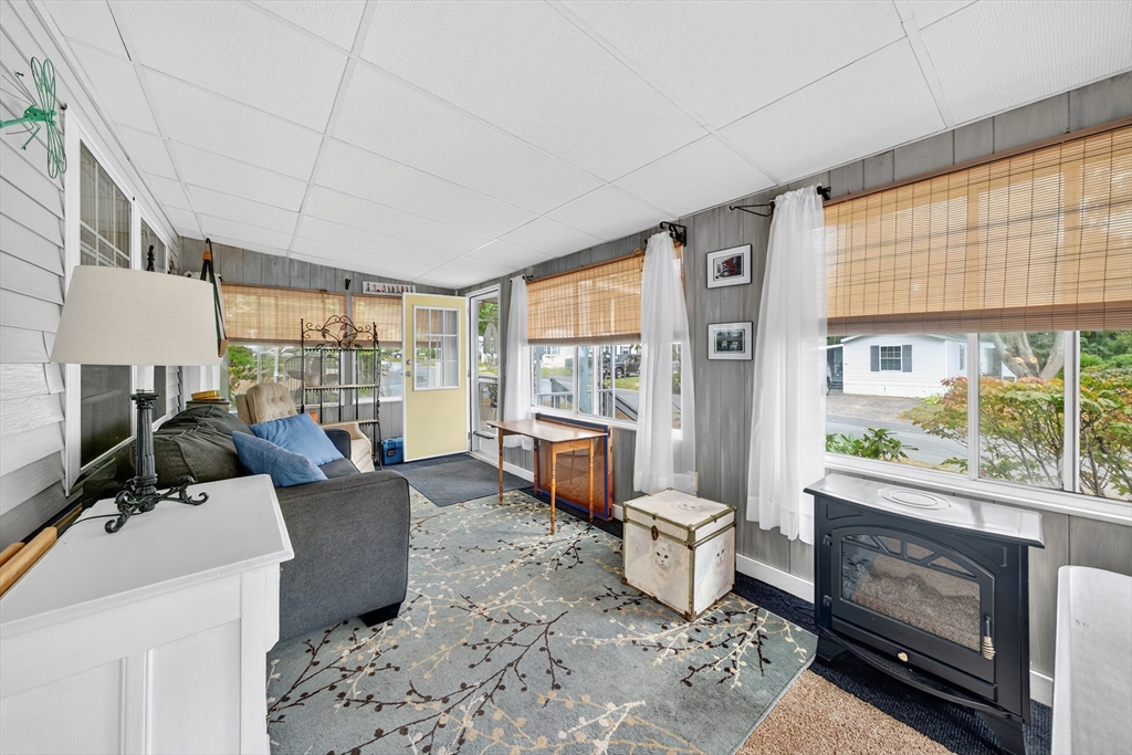 32 Windswept Road Wareham, MA 02576 - Photo 9 of 39 a living room with furniture and a fireplace