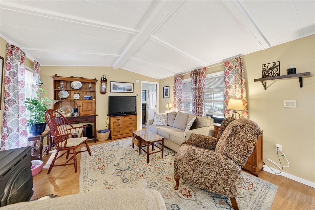32 Windswept Road Wareham, MA 02576 - Photo 10 of 39 a living room with furniture and a fireplace