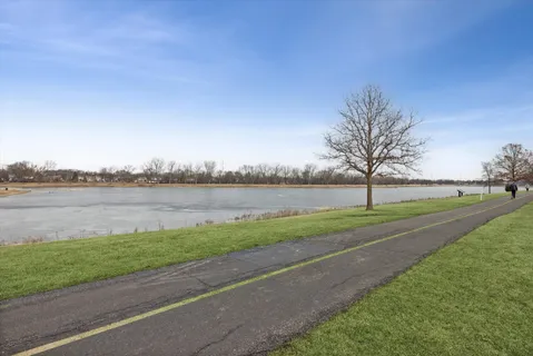 a view of a yard with a lake view