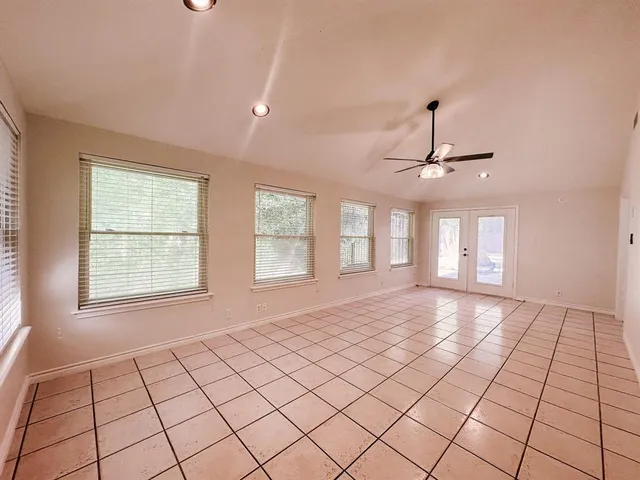 wooden floor in an empty room with a fireplace