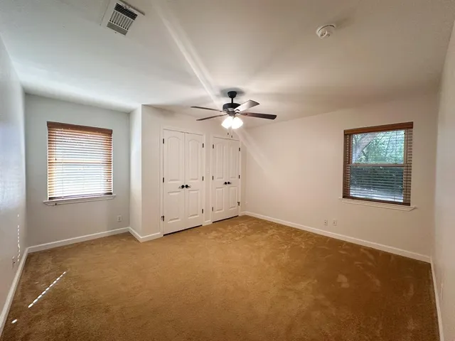 a view of a lake with houses in the background