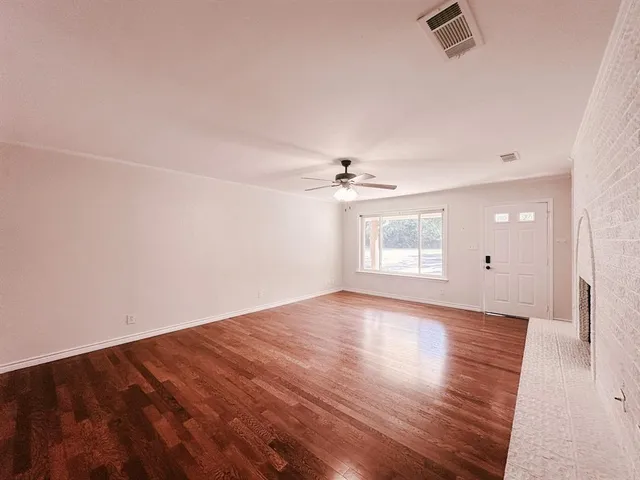 a kitchen with granite countertop cabinets and steel appliances
