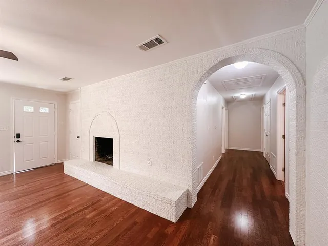 a kitchen with stainless steel appliances kitchen island granite countertop a sink and cabinets
