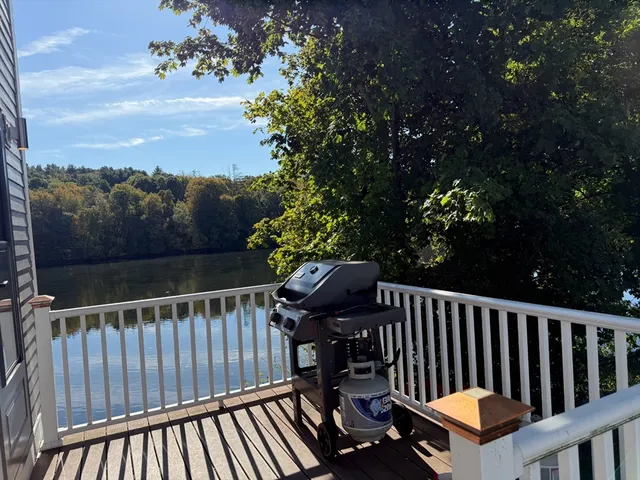 a view of balcony with wooden floor